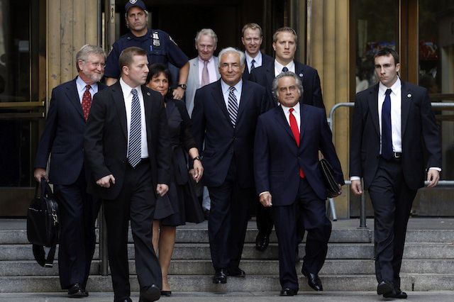 Dominique Strauss-Kahn, his wife Anne Sinclair, and his defense team exit the courthouse.
